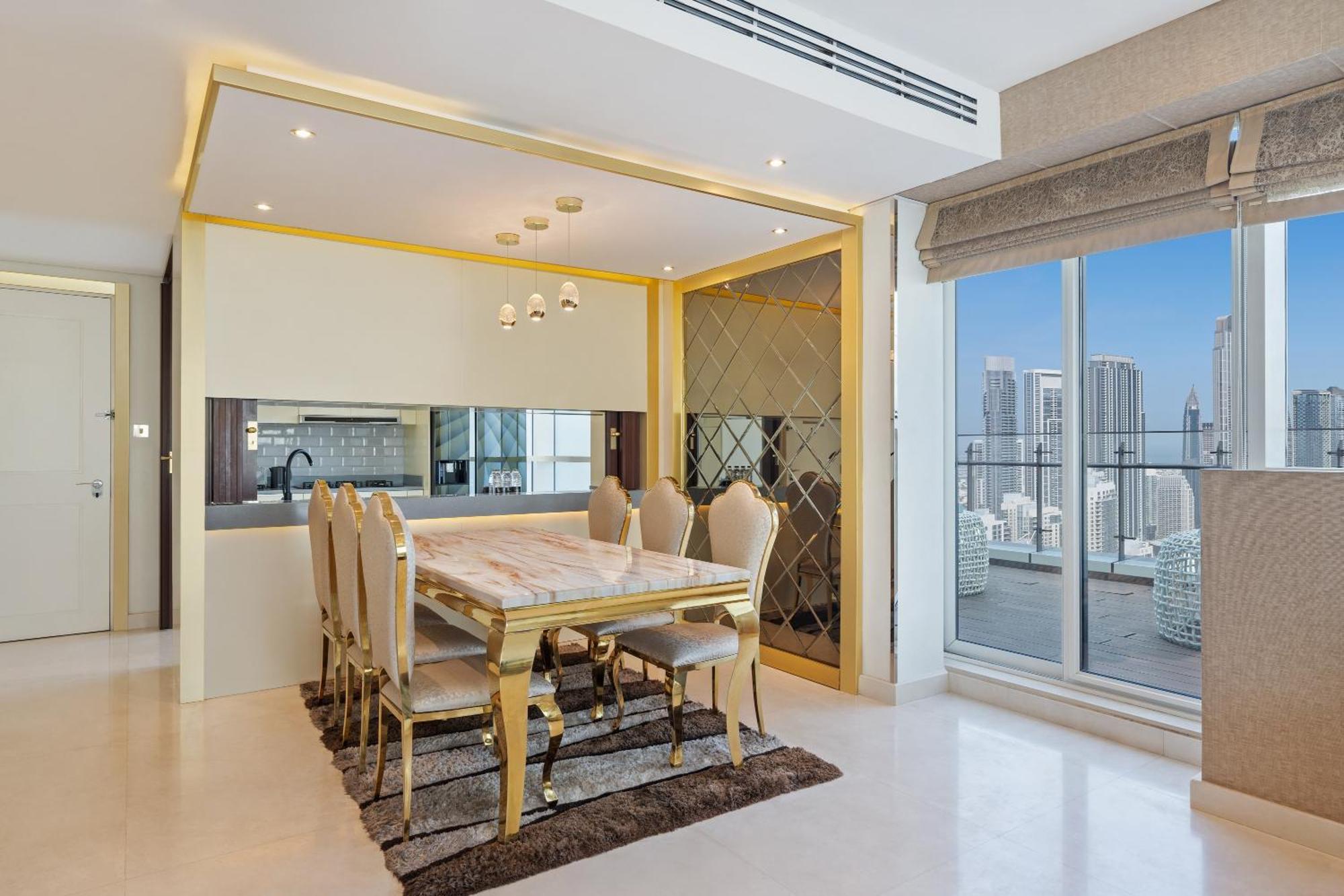 Damac Maison Distinction Dubai Esterno foto A dining room in a luxury apartment