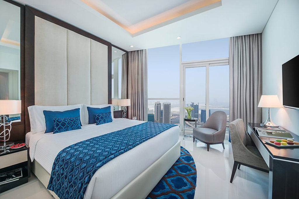 Damac Maison Distinction Dubai Esterno foto A bedroom at the hotel